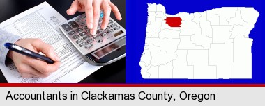 an accountant at work; Clackamas County highlighted in red on a map