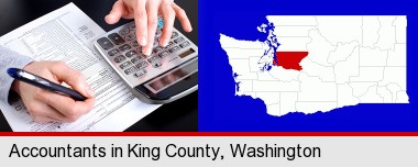 an accountant at work; King County highlighted in red on a map