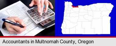 an accountant at work; Multnomah County highlighted in red on a map