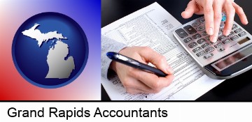 an accountant at work in Grand Rapids, MI