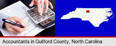 an accountant at work; Guilford County highlighted in red on a map