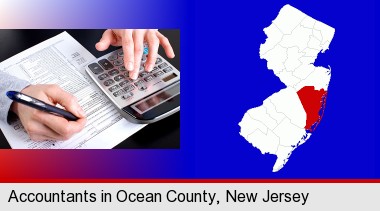 an accountant at work; Ocean County highlighted in red on a map