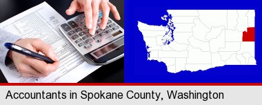 an accountant at work; Spokane County highlighted in red on a map