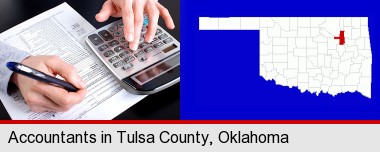 an accountant at work; Tulsa County highlighted in red on a map
