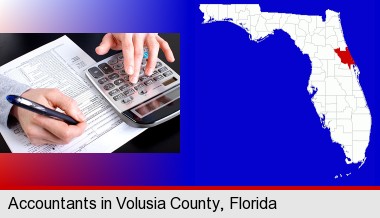 an accountant at work; Volusia County highlighted in red on a map