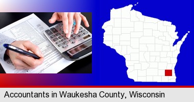 an accountant at work; Waukesha County highlighted in red on a map